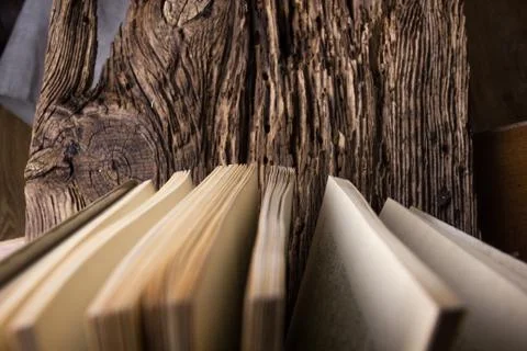 Top view of old book stack over old grunge natural wooden shabby Stock-Fotos