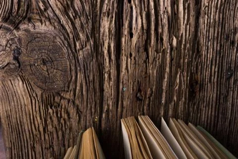 Top view of old book stack over old grunge natural wooden shabby Stock Photos