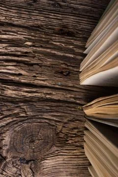 Top view of old book stack over old grunge natural wooden shabby Stock Photos