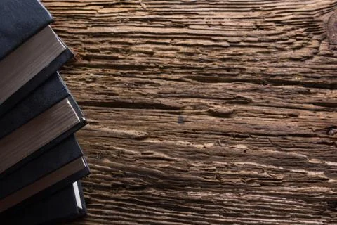 Top view of old book stack over old grunge natural wooden shabby Stock-Fotos