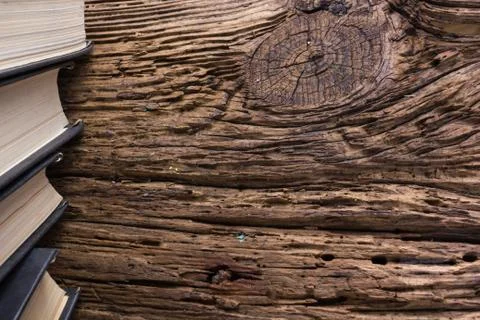 Top view of old book stack over old grunge natural wooden shabby Stock-Fotos