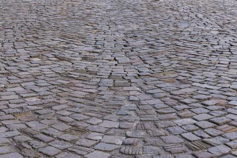 Top view of an old cobblestone paved road. Stock Photos