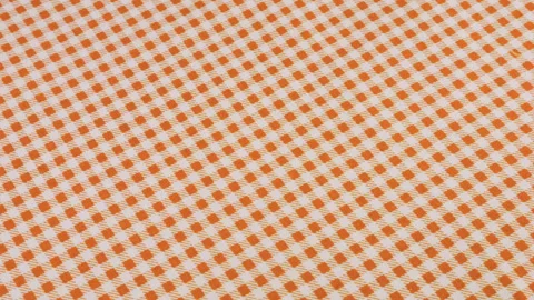 Top view of the old rose pink and white color cage cotton fabric rotated Stock Footage 293877808
