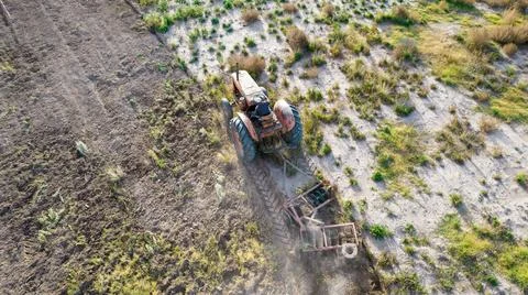 Top view of old tractor plowing. Aerial photo.Top view of old tractor plowing Stock Photos