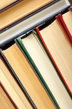 Top view of old used colorful hardback books. Back to school Stock Photos