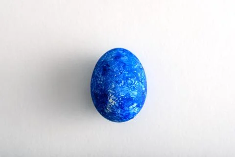 Top view one Easter egg in the color of year-classic blue on white background Stock Photos