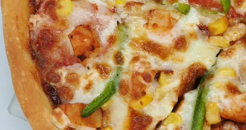 Top View Of A One Edge Of A Rotating BBQ lover's Pizza, London, UK Stock Footage 267616467