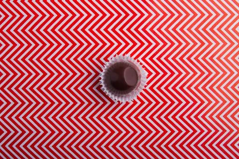 Top view one single round milk chocolate candy. Stock Photos