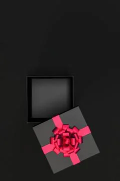 Top view of open black gift box with red ribbon and bow isolated on black Illustrazione stock