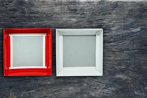 Top view open blank box white gray with cover red on a retro wood table bac.. Stock Photos