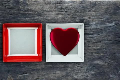 Top view of open blank box white gray with a red cover and red heart shape .. Stock Photos