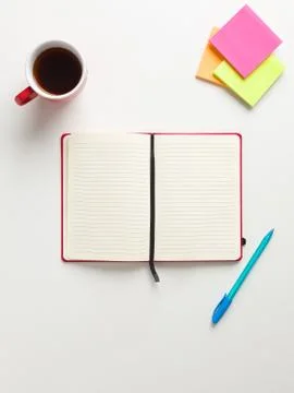 Top view of an open blank red notebook in the center, colored reminders in hi 写真素材