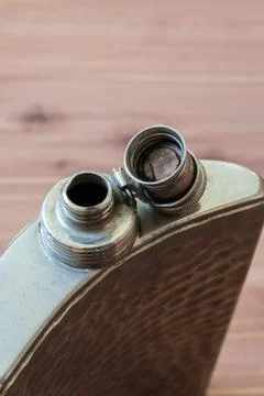 Top view of open curved flask, drinking alcoholism addiction concept Stock Photos