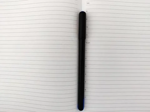 Top view of open diary with pen. Copy space Stock Photos