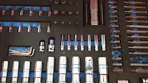 Top view of the open drawers with working tools, red metal box with slots 스톡 동영상 122288128