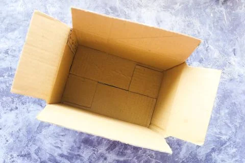 Top view of open empty cardboard box on table. 写真素材