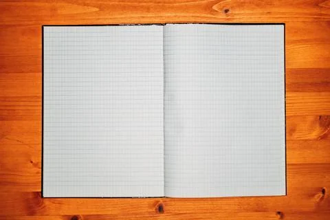 Top view of open empty notebook with rectangular grid pattern pages Stock Photos