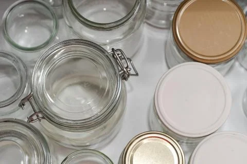 Top view of open kitchen drawer with glass jars Photos