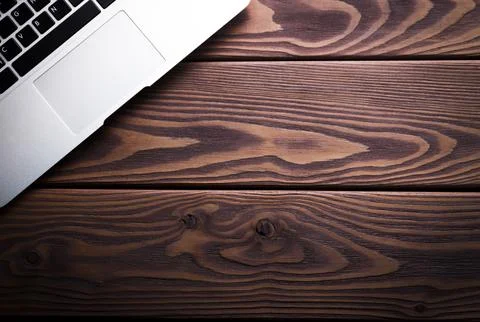Top view of open laptop ready to work standing on the wooden table, above. Stock Photos