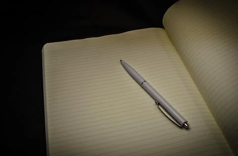 Top view of a open notebook with pen, school notebooks with a spiral spring, Stock Photos