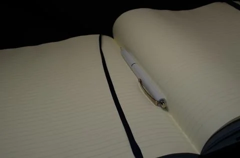 Top view of a open notebook with pen, school notebooks with a spiral spring, Stock Photos