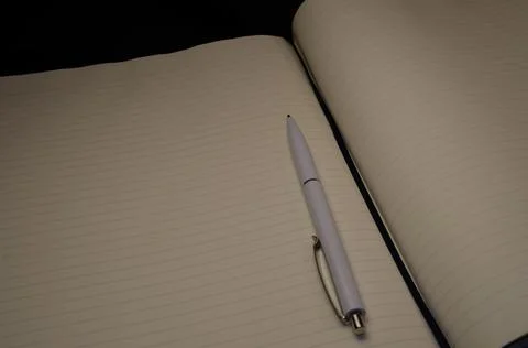 Top view of a open notebook with pen, school notebooks with a spiral spring Stock Photos