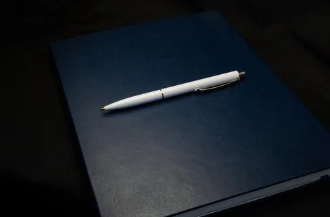Top view of a open notebook with pen, school notebooks with a spiral spring Stock Photos