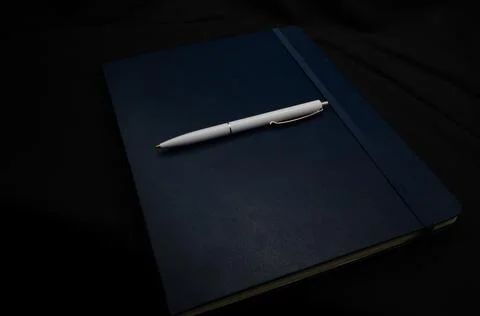 Top view of a open notebook with pen, school notebooks with a spiral spring Stock Photos