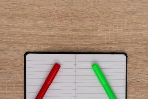 Top view of open notepad with markers Stock Photos