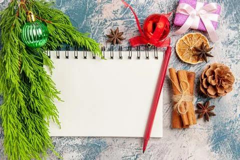 Top view open notepad with toys on light-blue background tree xmas new year.. Fotos Stock