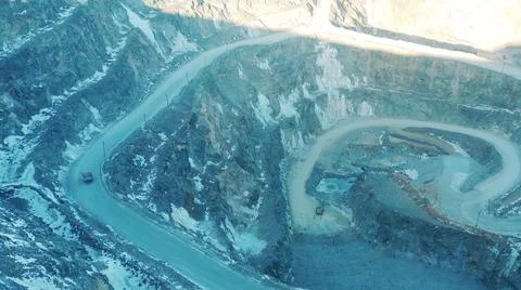 Top view of an open-pit mine with transport in it Photos
