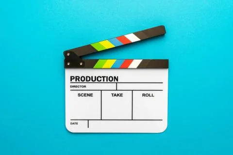 Top view of open white clapperboard on turquoise blue background and copy space Stock Photos
