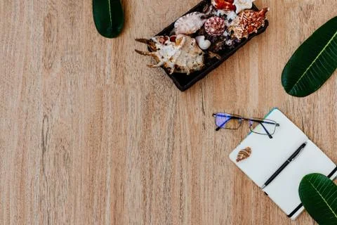 Top view of an open white notebook with pen on a light wooden table Stock Photos