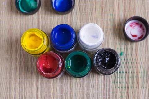 Top view of opened bottles of poster paint Stock Photos