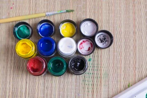 Top view of opened bottles of poster paint Stock Photos