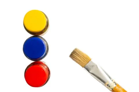 Top view of opened bottles of primary color on white background. Stock Photos