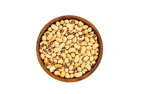 Top view or flat lay of fresh raw white bean in wooden bowl. Stock Photos