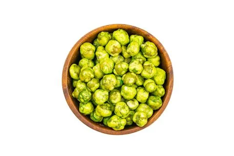 Top view or flat lay of dry crispy wasabi coated green peas in wooden bowl. Stock Photos
