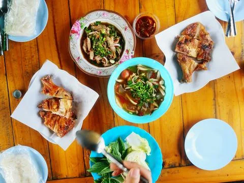 Top view or flat lay of local Thai food with hand Stock Photos