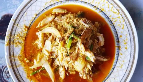 Top view or flat lay of stir fried crab with curry powder, onions Stock Photos