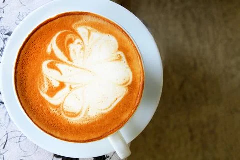 Top view or Flat lay of white cup of cappuccino with art latte on table Stock Photos