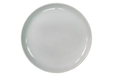 Top view or flat lay of single empty white ceramic plate. Stock Photos
