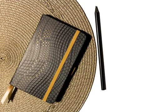 Top view or flat view or concept of closed organizer with black pencil lying Stock Photos