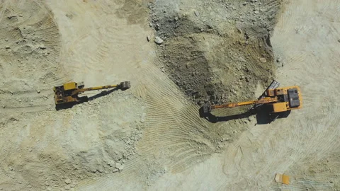 Top view of orange excavator working in quarries site Stock Footage 202617515
