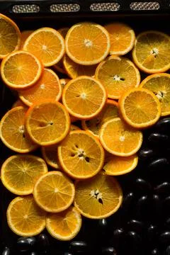 Top view of orange slices, jamun,java plum fruits isolated on dark background. 库存照片