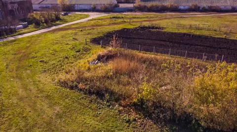 Top view over an old small rural vegetable garden flight altitude Stock Photos