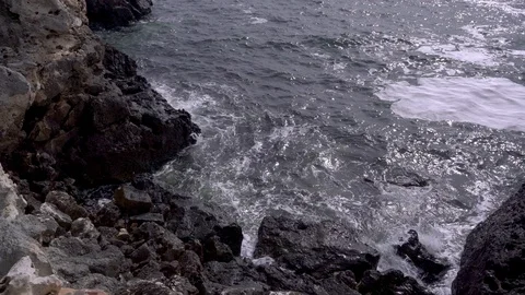 Top view over sea waves on stony coast Stock-Footage 88259197