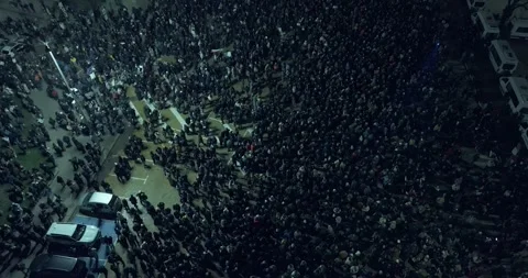 Top view over a square in Sofia with thousands of people at night Stock Footage 324575760