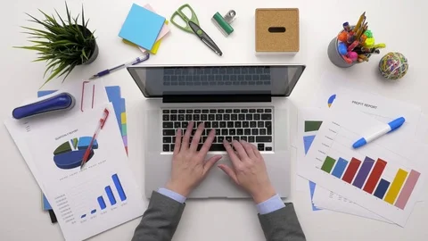 Top View Overhead Of Financial Analyst Checking Data On Laptop Stock Footage 79648035