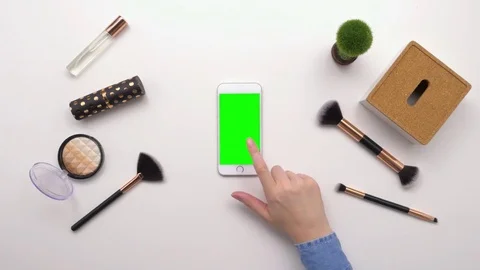 Top View Overhead Of Woman Using Smartphone By Beauty Products Stock Footage 79648685